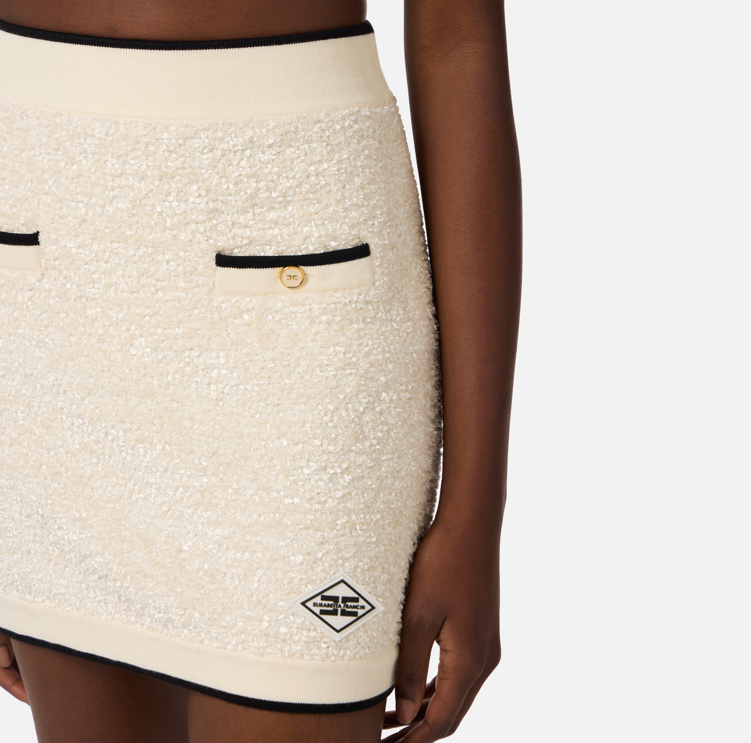 Miniskirt in bouclé chenille fabric with contrasting details